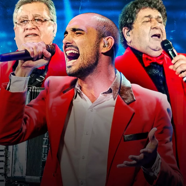 Na imagem os artistas cantam segurando o microfone.
